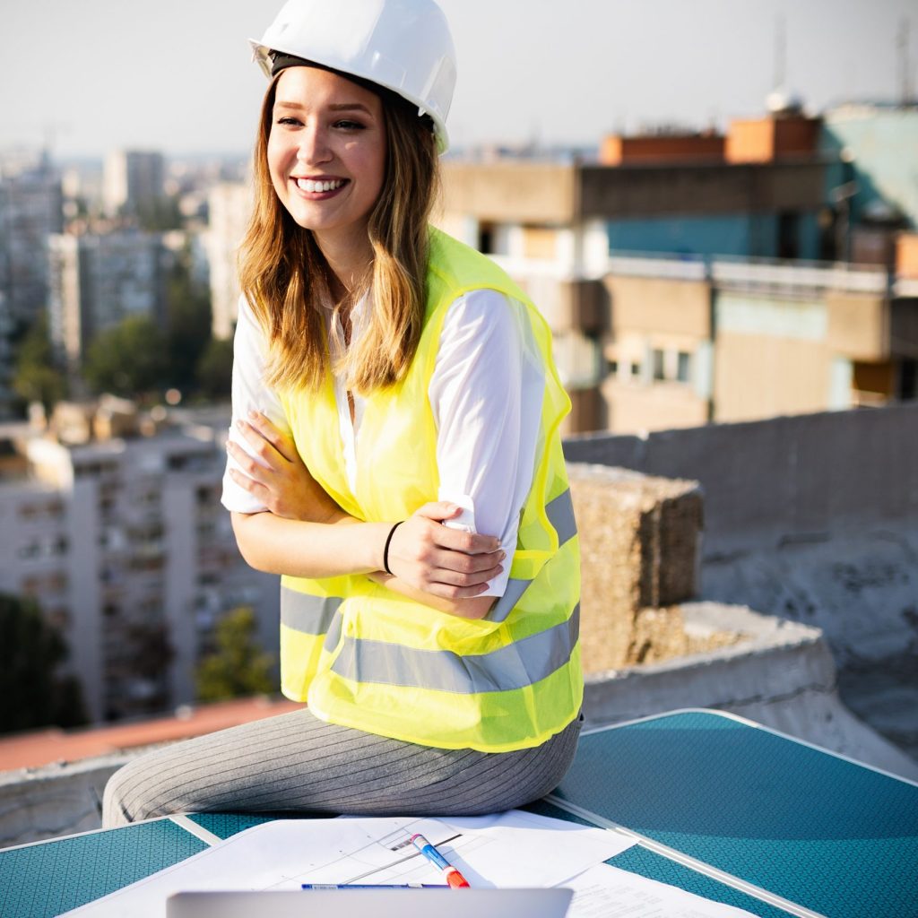 Young woman architect, construction engineer at a construction site